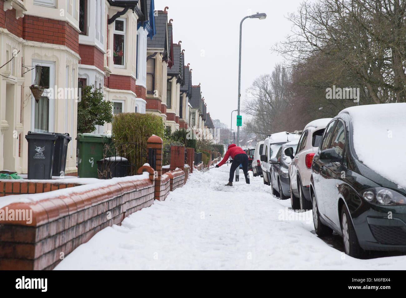 Cardiff, Wales, UK, March 3rd 2018. A resident digs snow away from their house as Britain reels from a major spell of wintry weather. Credit: Mark Hawkins/Alamy Live News Stock Photo
