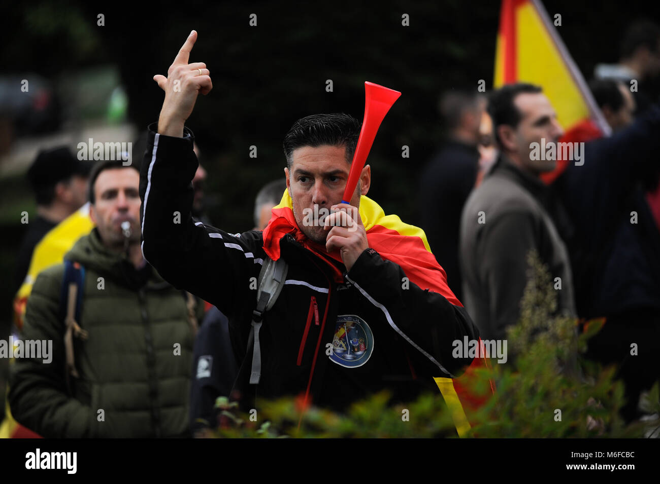 Malaga, Spain. 3rd Mar, 2018. A man with spanish flag uses a whistle as
