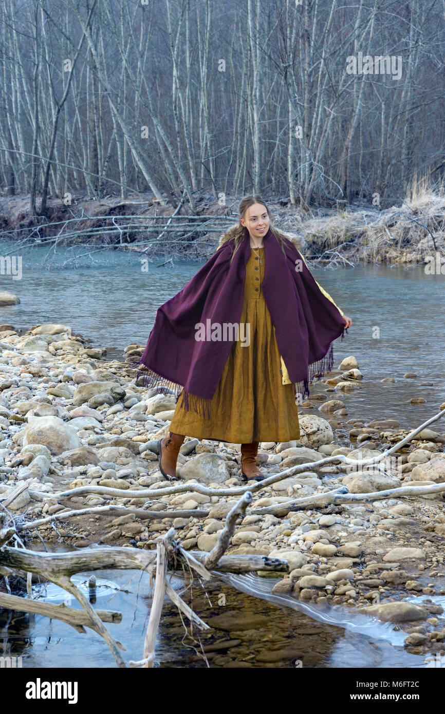 Model posing against the backdrop of a mountain river Stock Photo