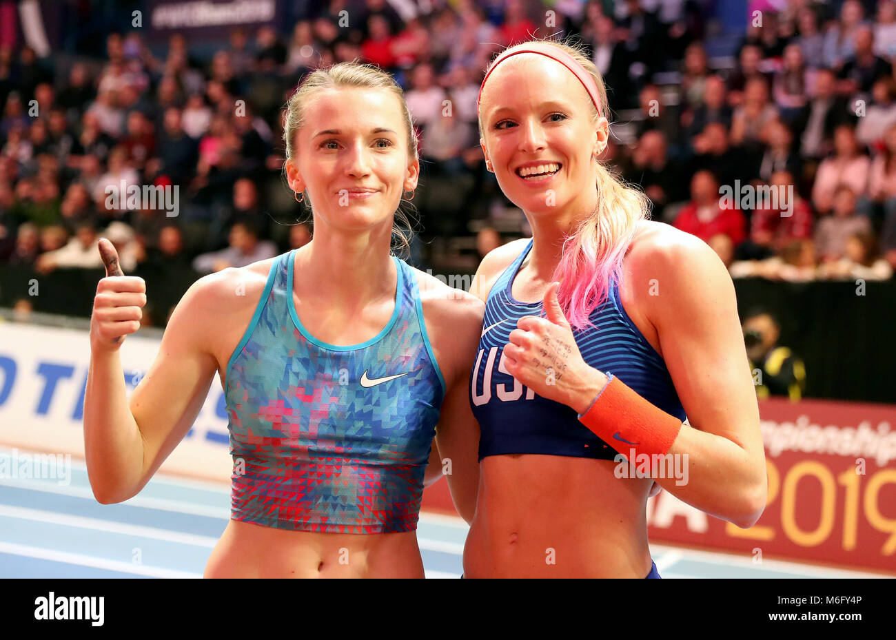 USA's Sandi Morris (right) and Authorised Neutral Athlete's Anzhelika Sidorova celebrate winning medels at the Woman's Pole Vault Final during day three of the 2018 IAAF Indoor World Championships at The Arena Birmingham. Stock Photo