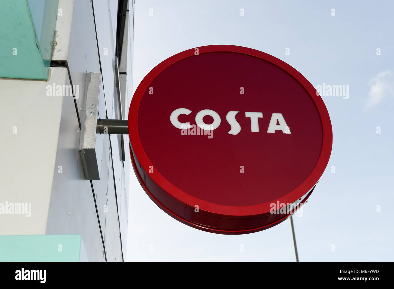 Costa coffee logo mounted circler sign attached to building outside new shop in Hilsea Portsmouth Hampshire England. Stock Photo