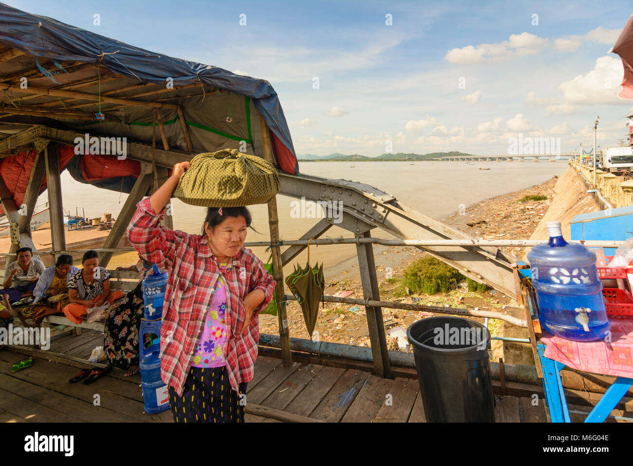 Mawlamyine (Mawlamyaing, Moulmein): riverfront at Thanlwin (Salween) River, ship, Thanlwin Bridge, lady, , Mon State, Myanmar (Burma) Stock Photo