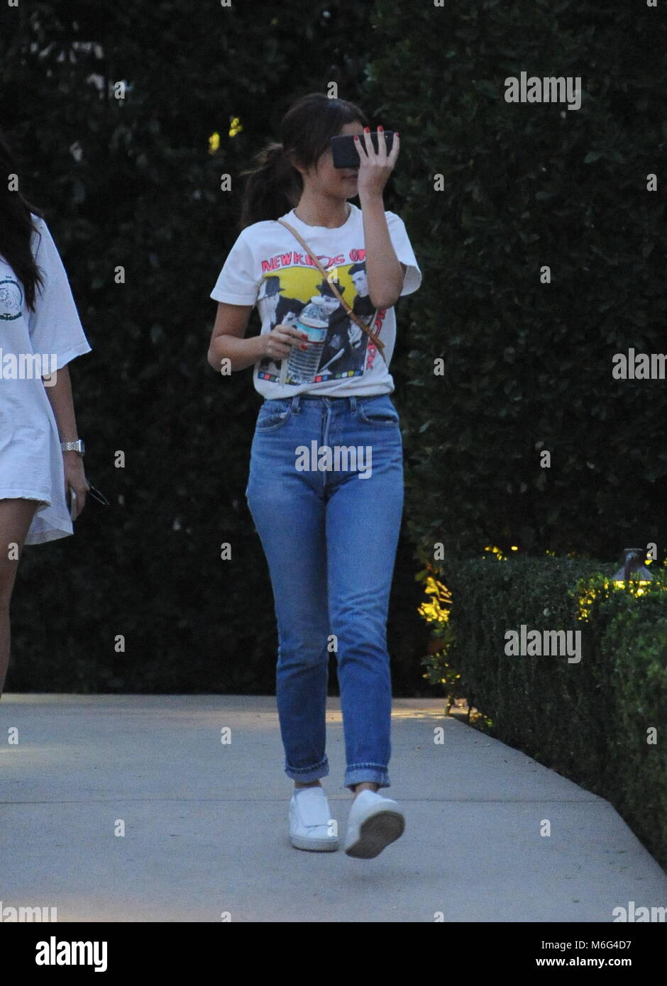 Selena Gomez shields her face while heading to a friends house Los