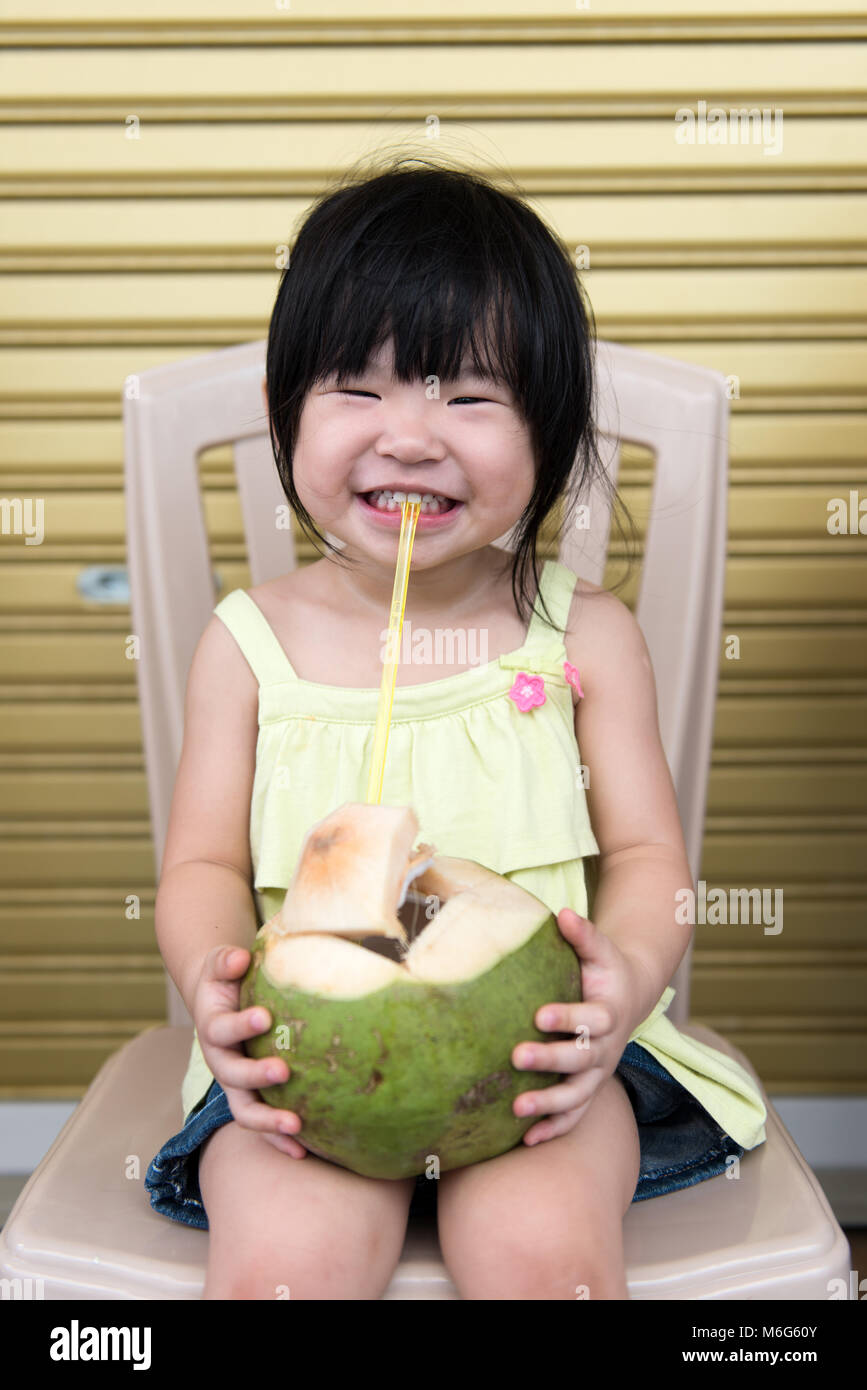 Girl drinking coconut water hi-res stock photography and images - Alamy