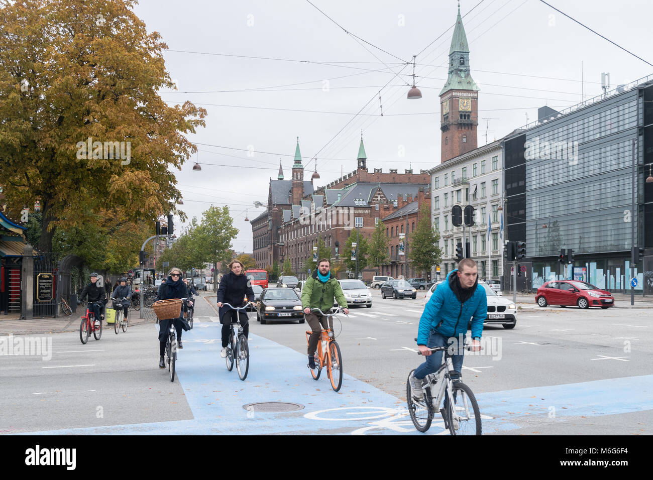 Copenhagen - October 23, 2016: Cyclers passing by  a street in Copenhagen Stock Photo