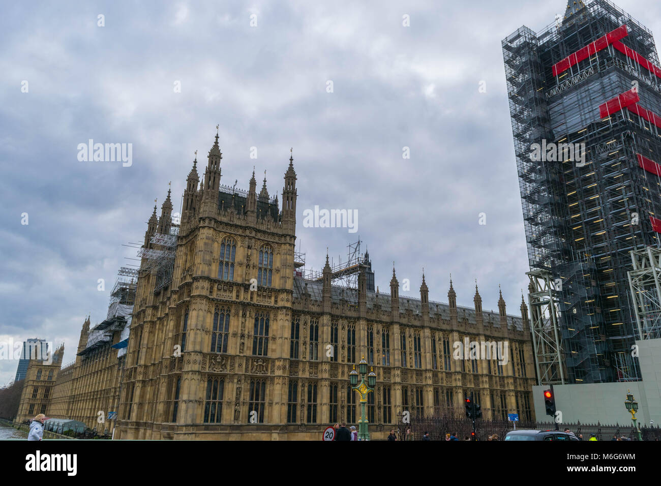 London, United Kingdom, February 17, 2018: Westminster bridge and big ben repain construction with the house of parliament in view, wintery skies Stock Photo