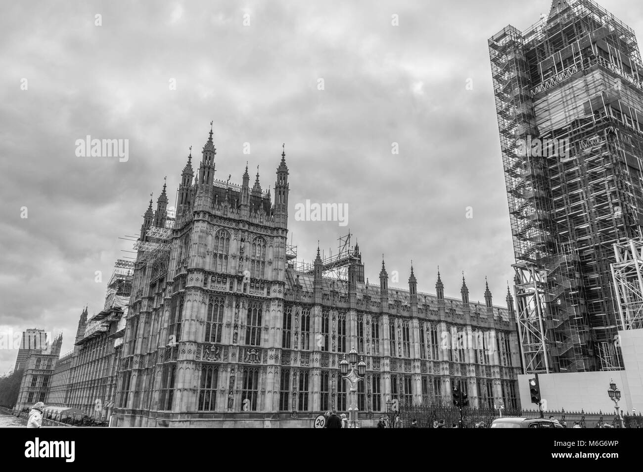 London, United Kingdom, February 17, 2018: Westminster bridge and big ben repain construction with the house of parliament in view, wintery skies Stock Photo