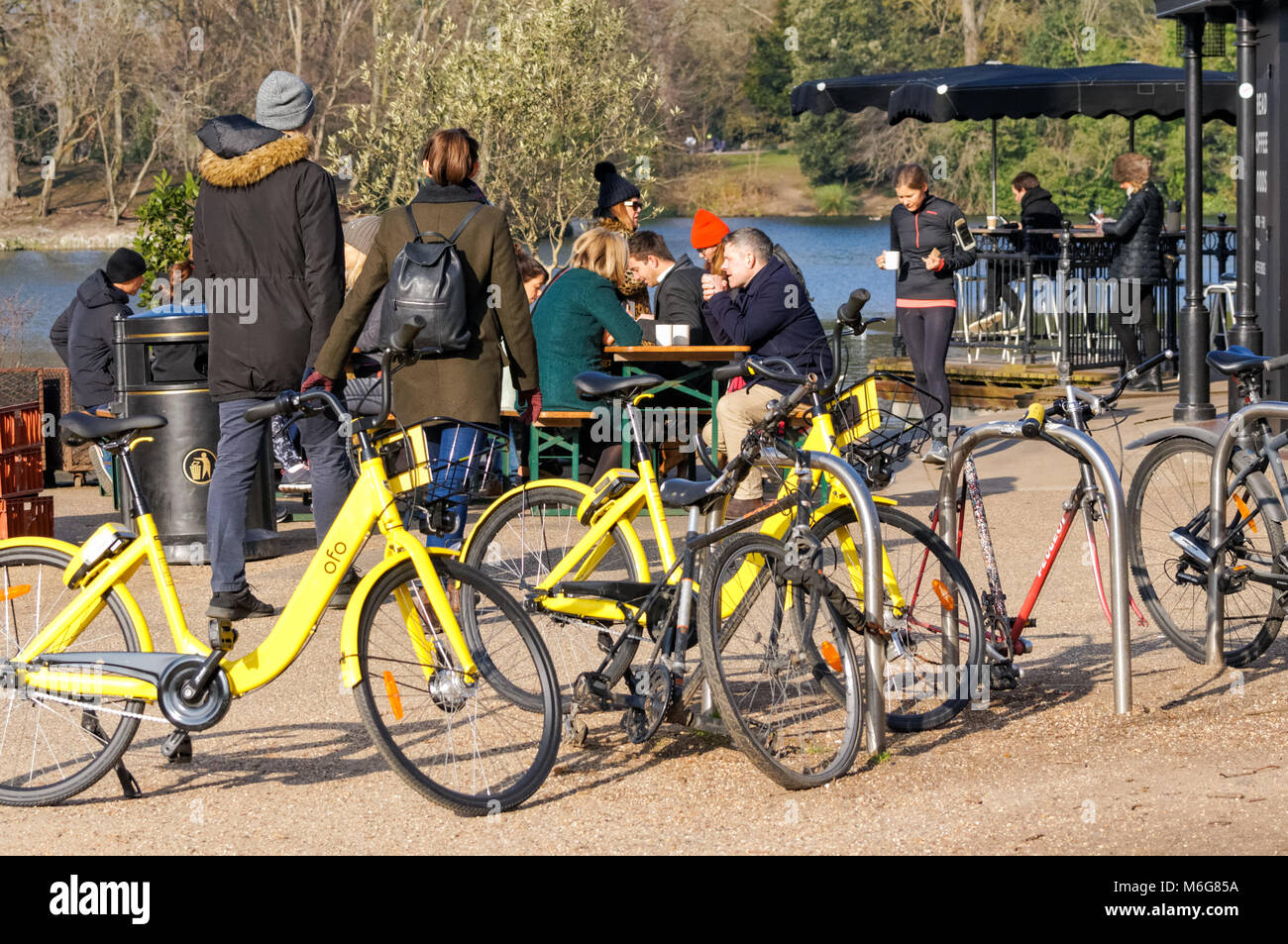 Young people at Pavilion Café in Victoria Park in the winter morning, Hackney, London, England, United Kingdom, UK Stock Photo