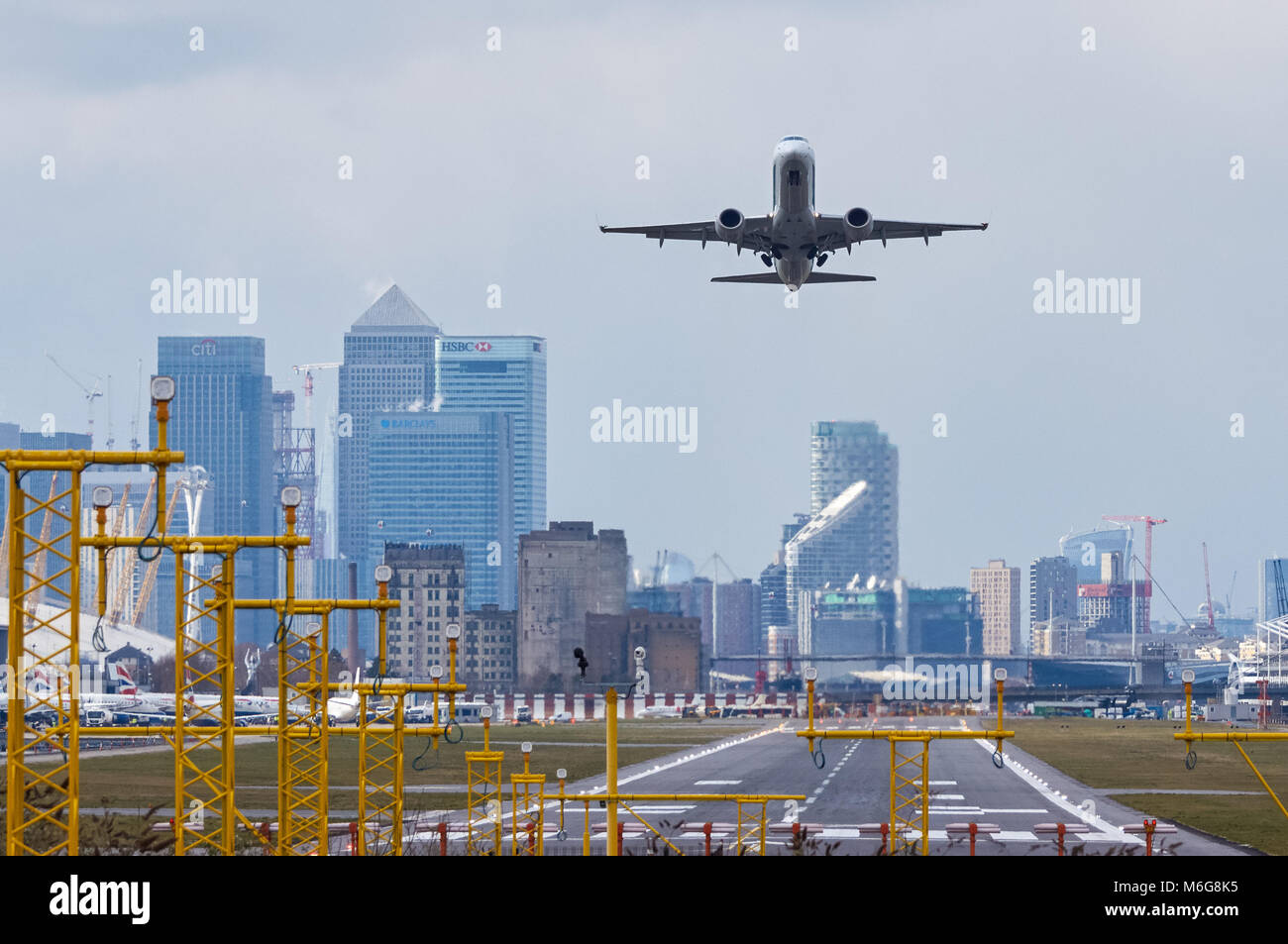 Airliner takes off at London City Airport, London England United Kingdom UK Stock Photo
