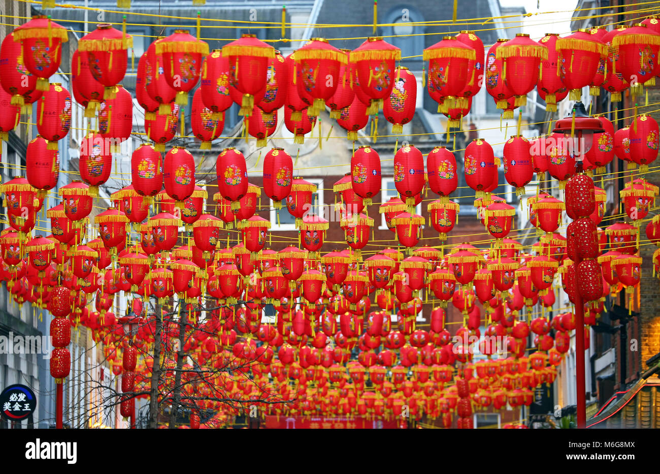 Traditional red Chinese lanterns strung across Gerrard Street in Chinatown for Chinese New Year, Year of the Dog 2018 in Chinatown, London, UK Stock Photo