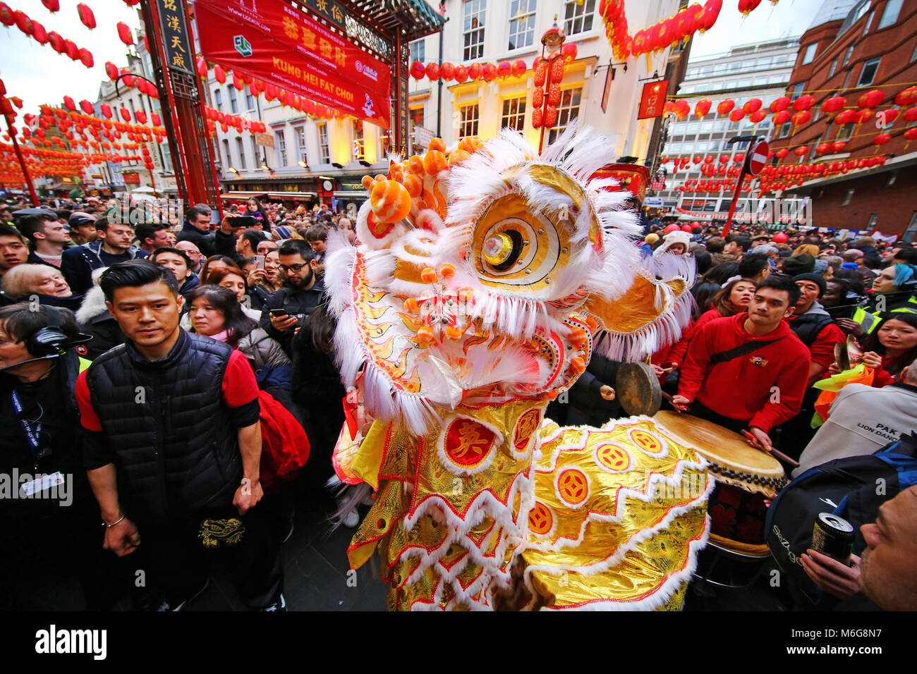 Lion Dance in Gerrard Street in Chinatown for Chinese New Year, Year of the Dog 2018 in Chinatown, London, UK Stock Photo
