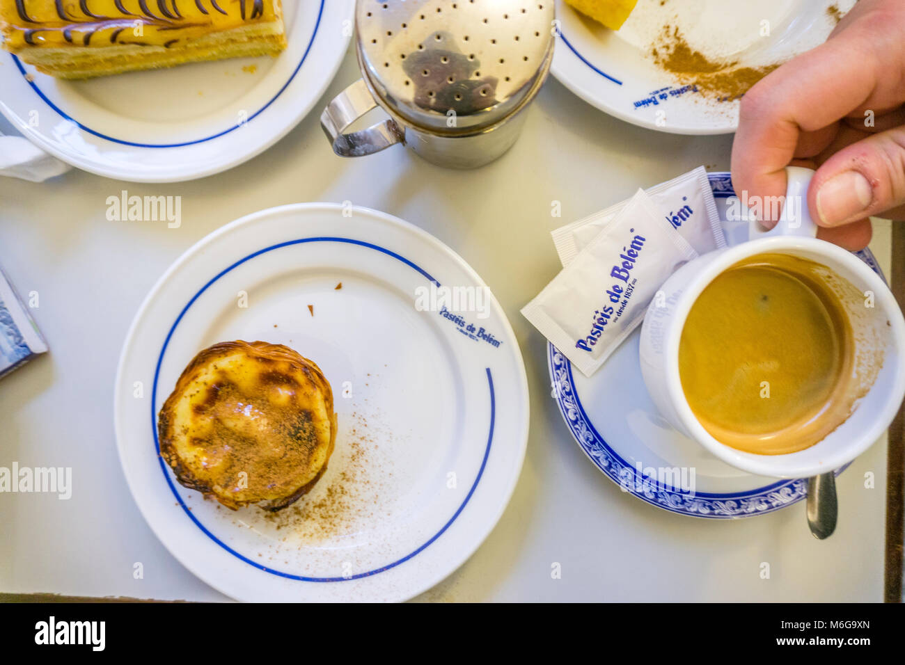 Lisbon, Portugal - January 31, 2018: Traditional portuguese pastry and coffee served in famous Pasteis de Belem Stock Photo