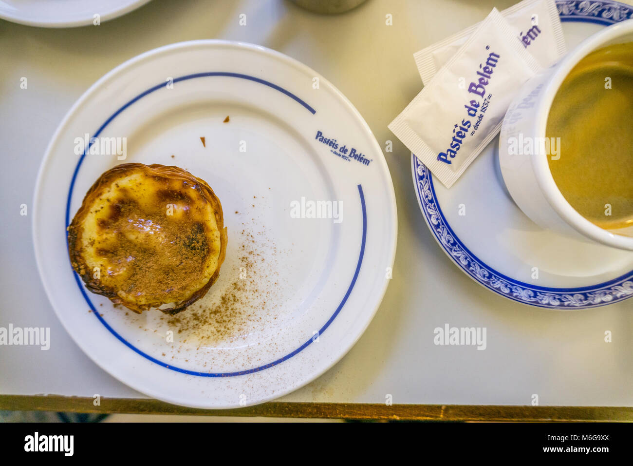Lisbon, Portugal - January 31, 2018: Traditional portuguese pastry and coffee served in famous Pasteis de Belem Stock Photo