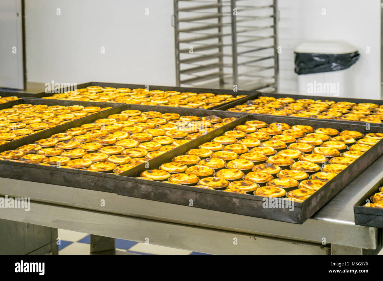 Production of traditional Portuguese eggs pastry called pastel de nata, Lisbon, Portugal Stock Photo
