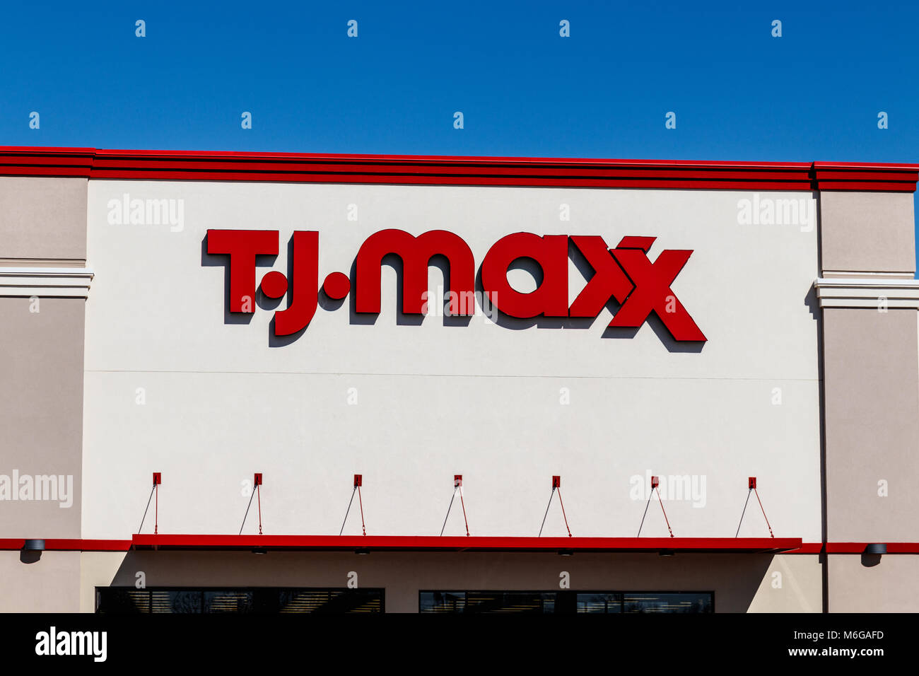 Indianapolis - Circa March 2018: T.J. Maxx Retail Store Location. T.J Maxx is a discount retail chain featuring stylish brand-name apparel, shoes and  Stock Photo