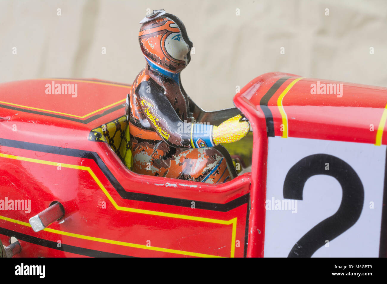 Wind up tin toy race car with driver Stock Photo - Alamy