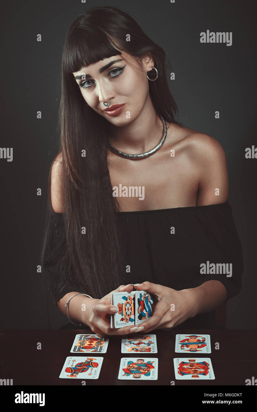 Beautiful gypsy woman with tarots. Fortune teller Stock Photo