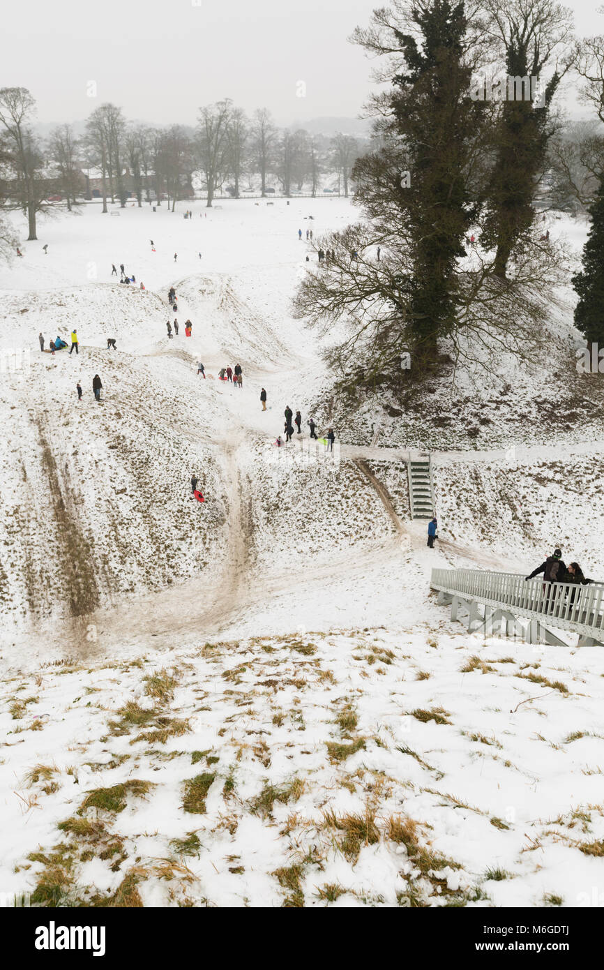 Aerial view from Castle Hill at Thetford, Norfolk of families playing and sledging on snow. Stock Photo