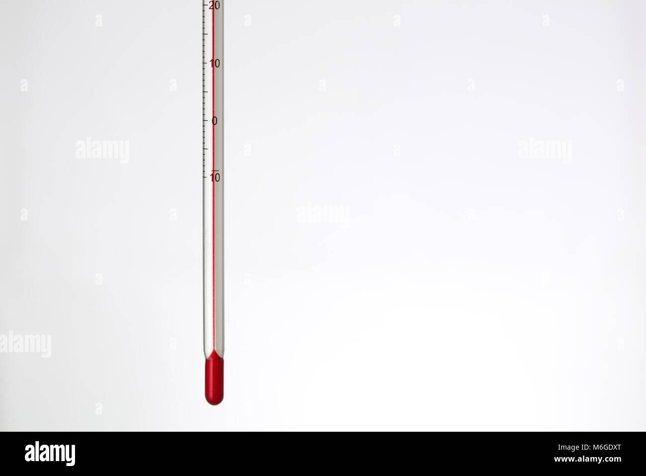 red thermometer isolated on a white background. Scientific medical measuring device Stock Photo