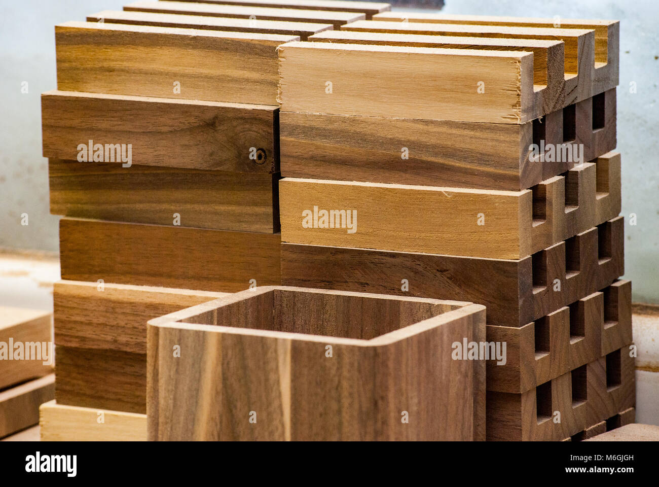 Arrangement of a series of small wood trays made of solid walnut wood