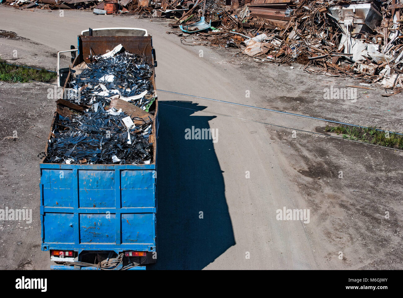 Scrap metal dump for recycling on the territory of the metallurgical plant with delivery by dump