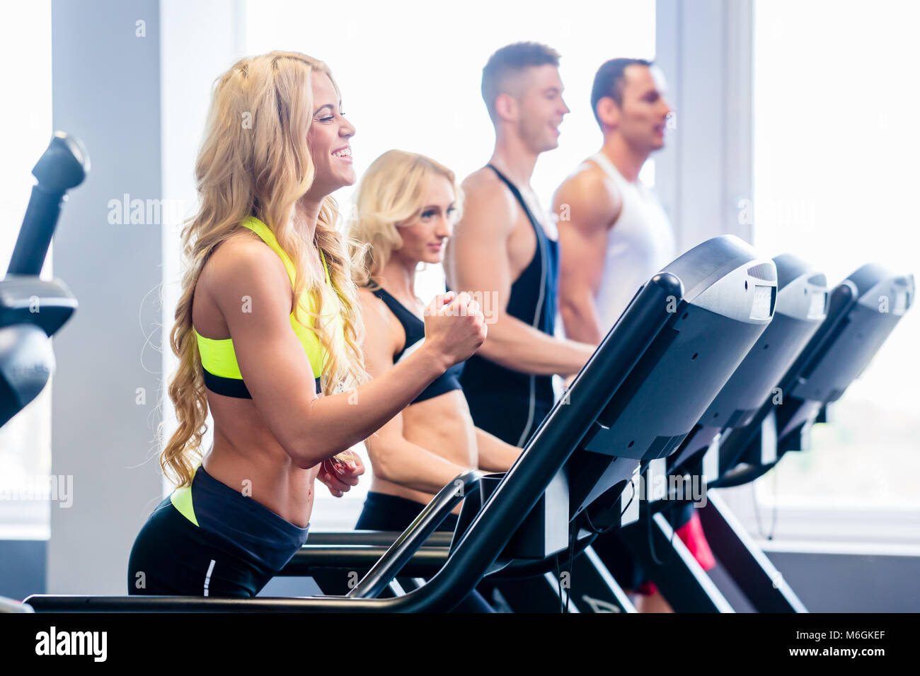 Treadmill group exercising in fitness gym Stock Photo