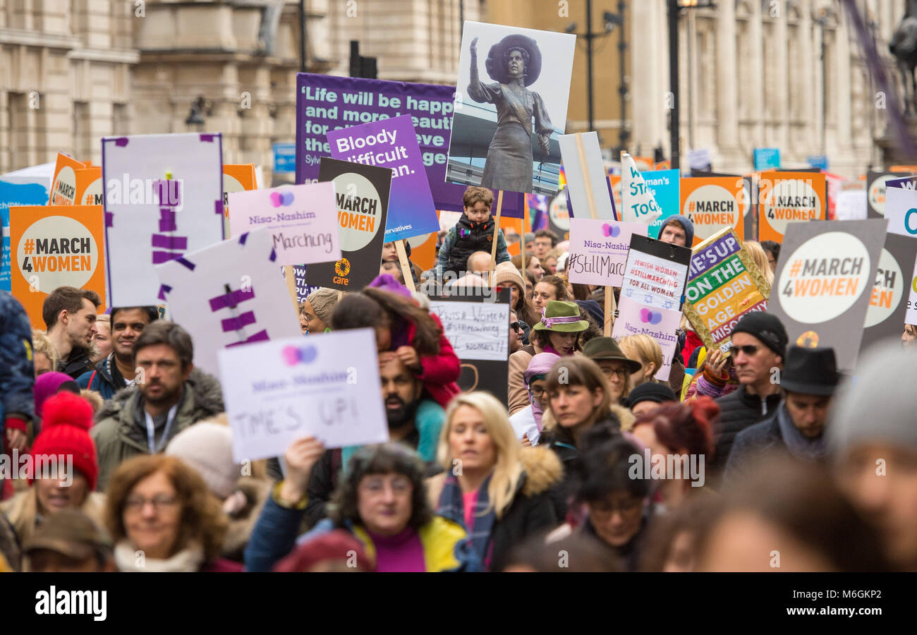 Marchers take part in the March4Women, in Westminster, London. Stock Photo