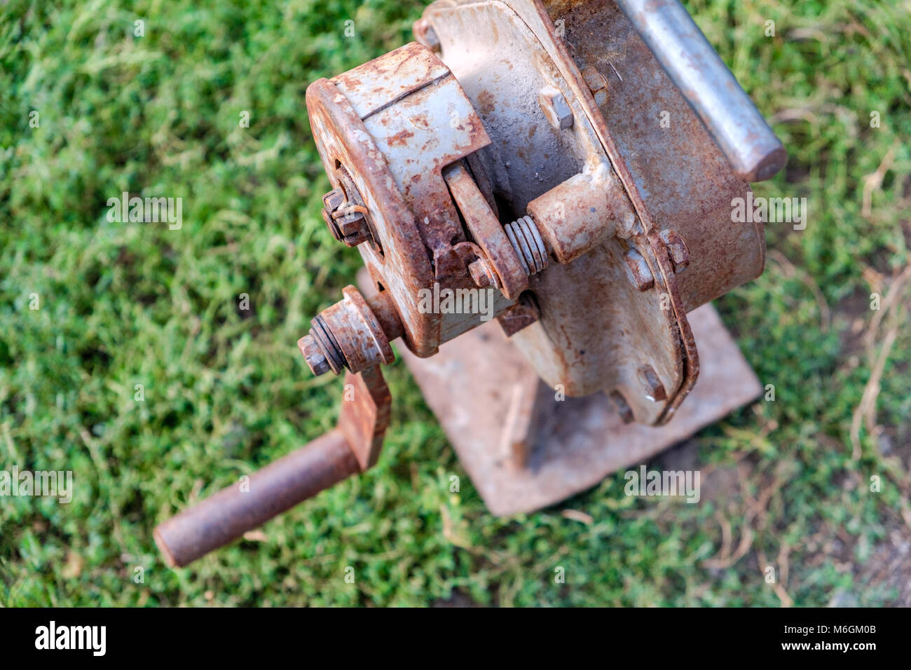 House lifting jack. Old rusty mechanical screw jack. Close-up Stock Photo