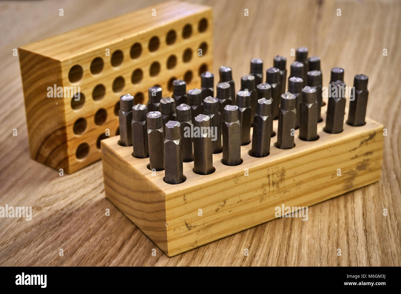 Metal stamps with letters for wood in a wooden box Stock Photo Alamy
