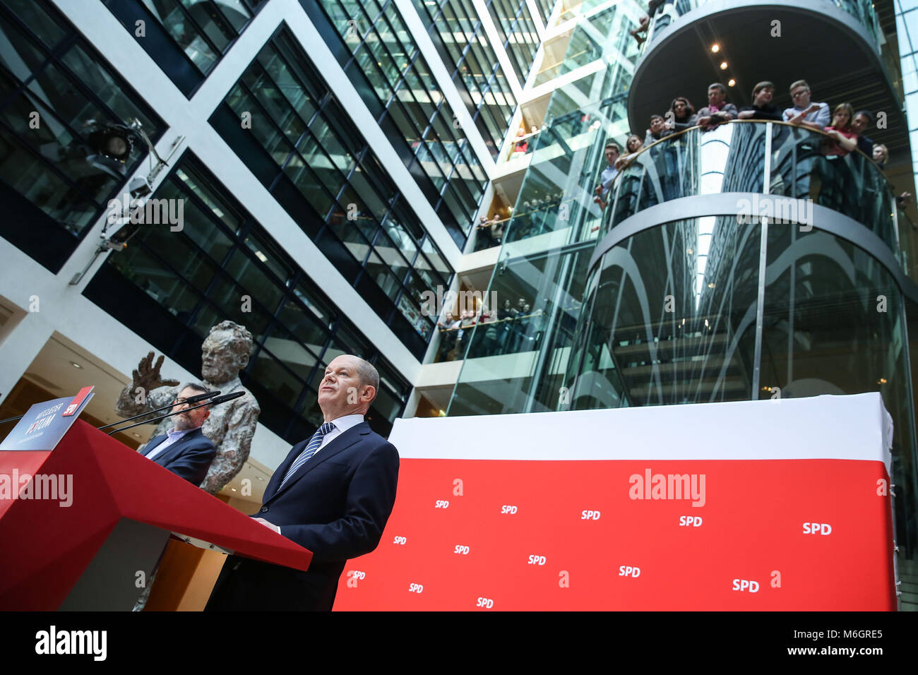 Berlin, Germany. 4th Mar, 2018. Interim leader of Germany's Social Democrats (SPD) party Olaf Scholz (R) and head of the SPD Mandate and Counting Commission Dietmar Nietan attend a press conference at the headquaters of SPD in Berlin, capital of Germany, on March 4, 2018. Germany's Social Democratic Party (SPD) voted for a government coalition with Chancellor Angela Merkel's Conservative Union, a party official said Sunday. Credit: Shan Yuqi/Xinhua/Alamy Live News Stock Photo