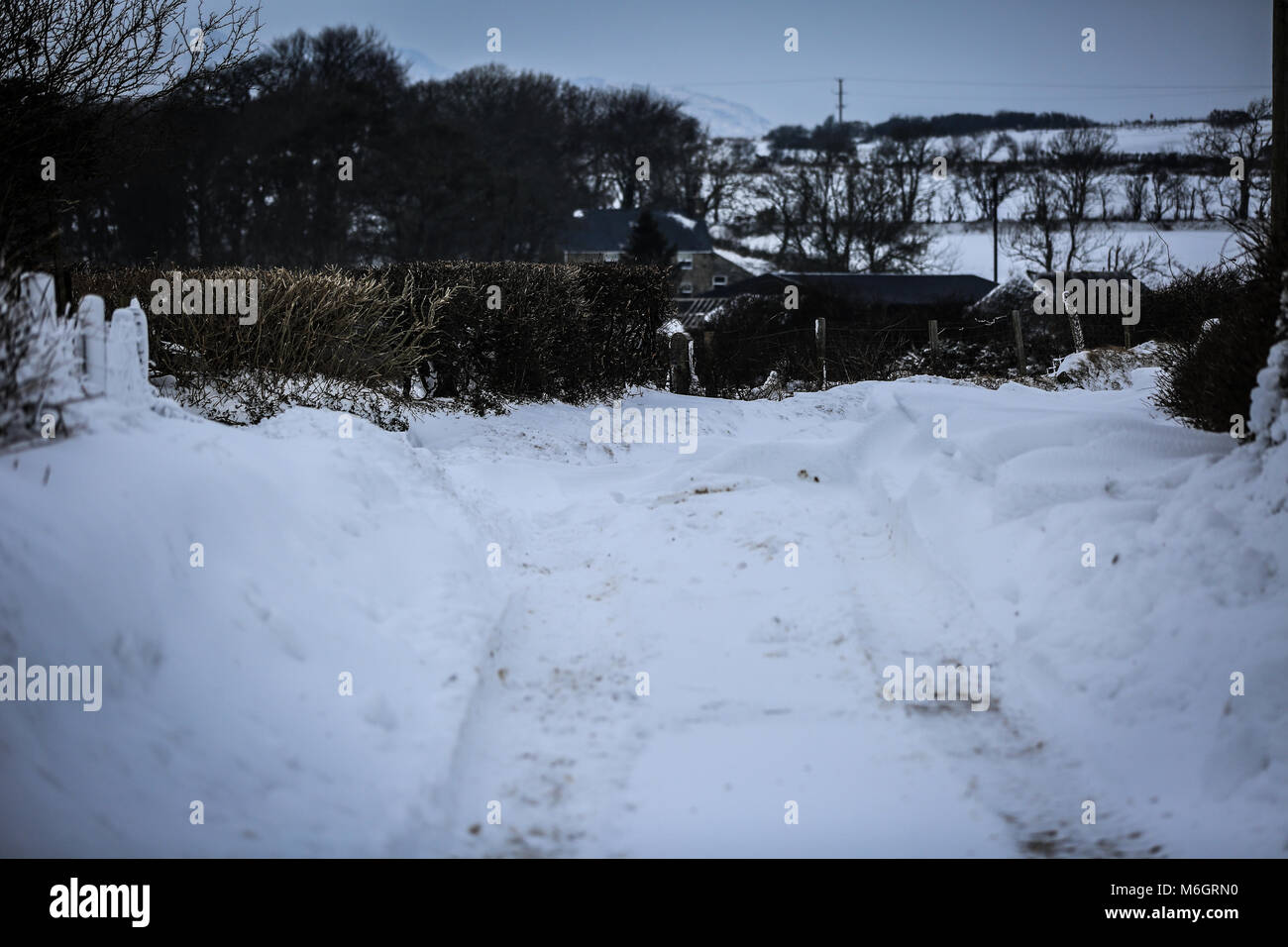 The after effects of Storm Emma is seen in the seaside village of Abersoch, with heavy snow drifts, wind, snow on the beach and a frozen harbour. Stock Photo