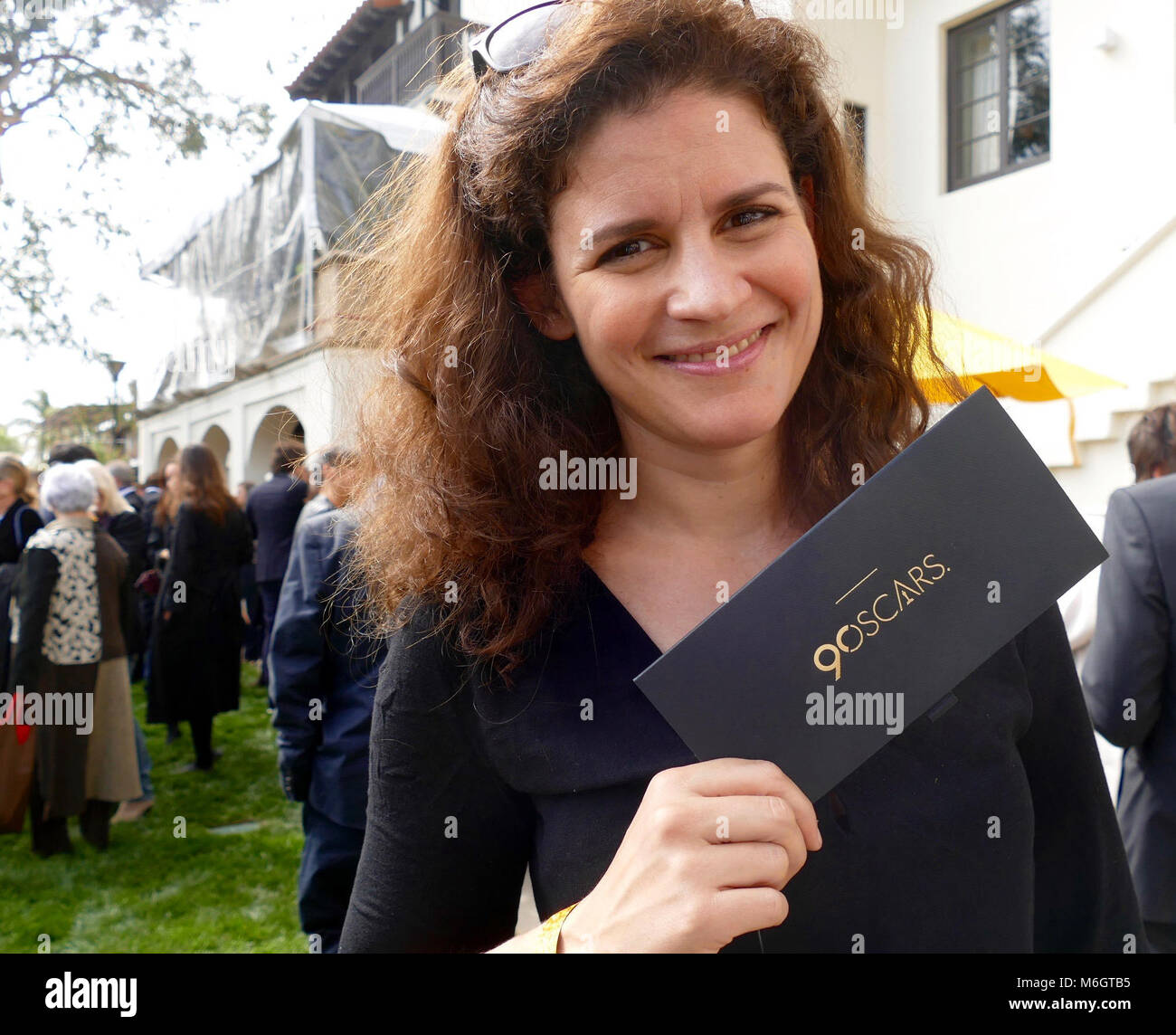03 March 2018, USA, Los Angeles: Director Katja Benrath shows her entry ticket for the 90th Academy Awards during the reception of the German nominees at Villa Aurora. The gala takes place on 04 March 2018. Photo: Barbara Munker/dpa Credit: dpa picture alliance/Alamy Live News Stock Photo