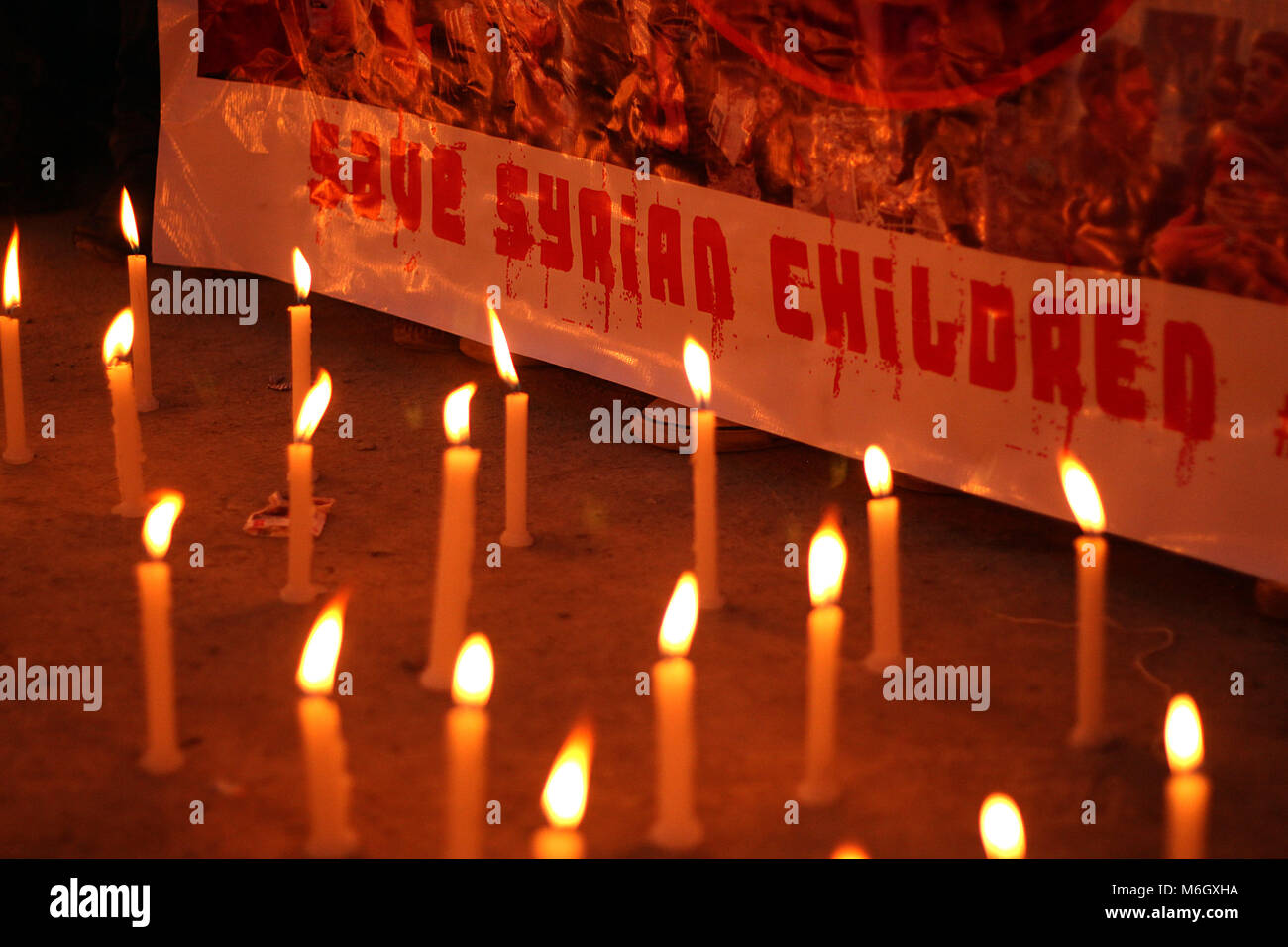 Srinagar, Jammu and Kashmir, India. 4th Mar, 2018. Candles are lit as people take part in candle-light vigil for Syrian children in Srinagar the summer capital of Indian administered Kashmir.More than 600 people have been killed including children and women after attacks in past two weeks in Ghouta, as Syrian government led by president Bashar-Al-Assad and Russian forces continued their aerial bombardment in Eastern part of Ghouta in Syria. Credit: Faisal Khan/ZUMA Wire/Alamy Live News Stock Photo