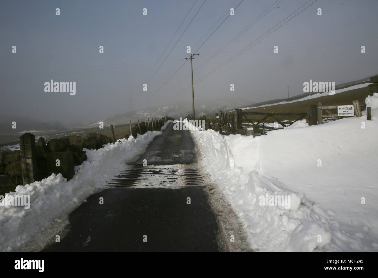 Path across moorland cleared of snow, Blackstone Edge, Littleborough