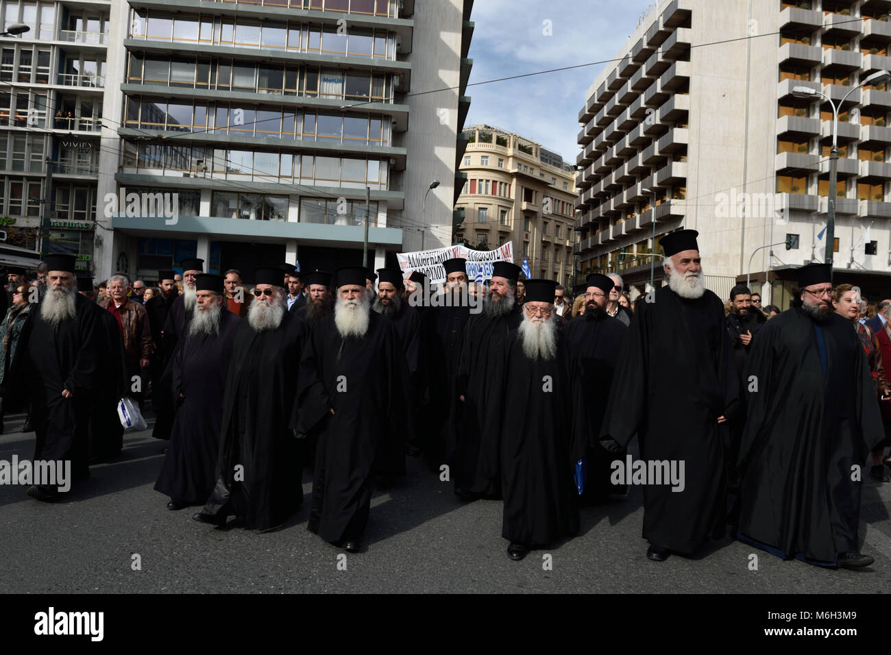Athens, Greece, 4th March, 2018. Greek Orthodox priests head the protest march against changes in the school religion textbooks in Athens, Greece. Credit: Nicolas Koutsokostas/Alamy Live News. Stock Photo