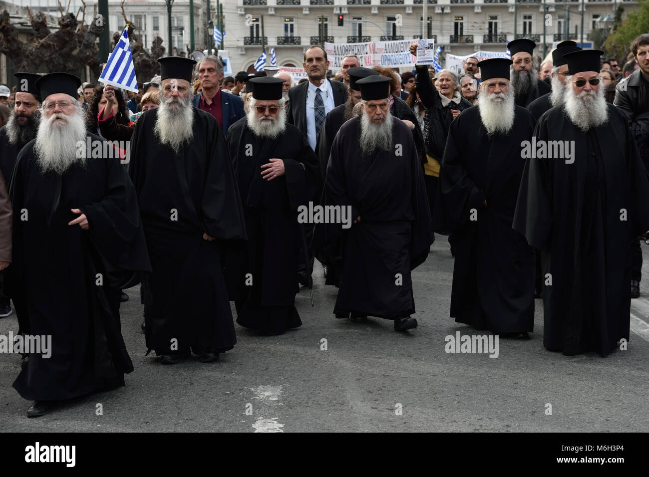 Athens, Greece, 4th March, 2018. Greek Orthodox priests head the protest march against changes in the school religion textbooks in Athens, Greece. Credit: Nicolas Koutsokostas/Alamy Live News. Stock Photo