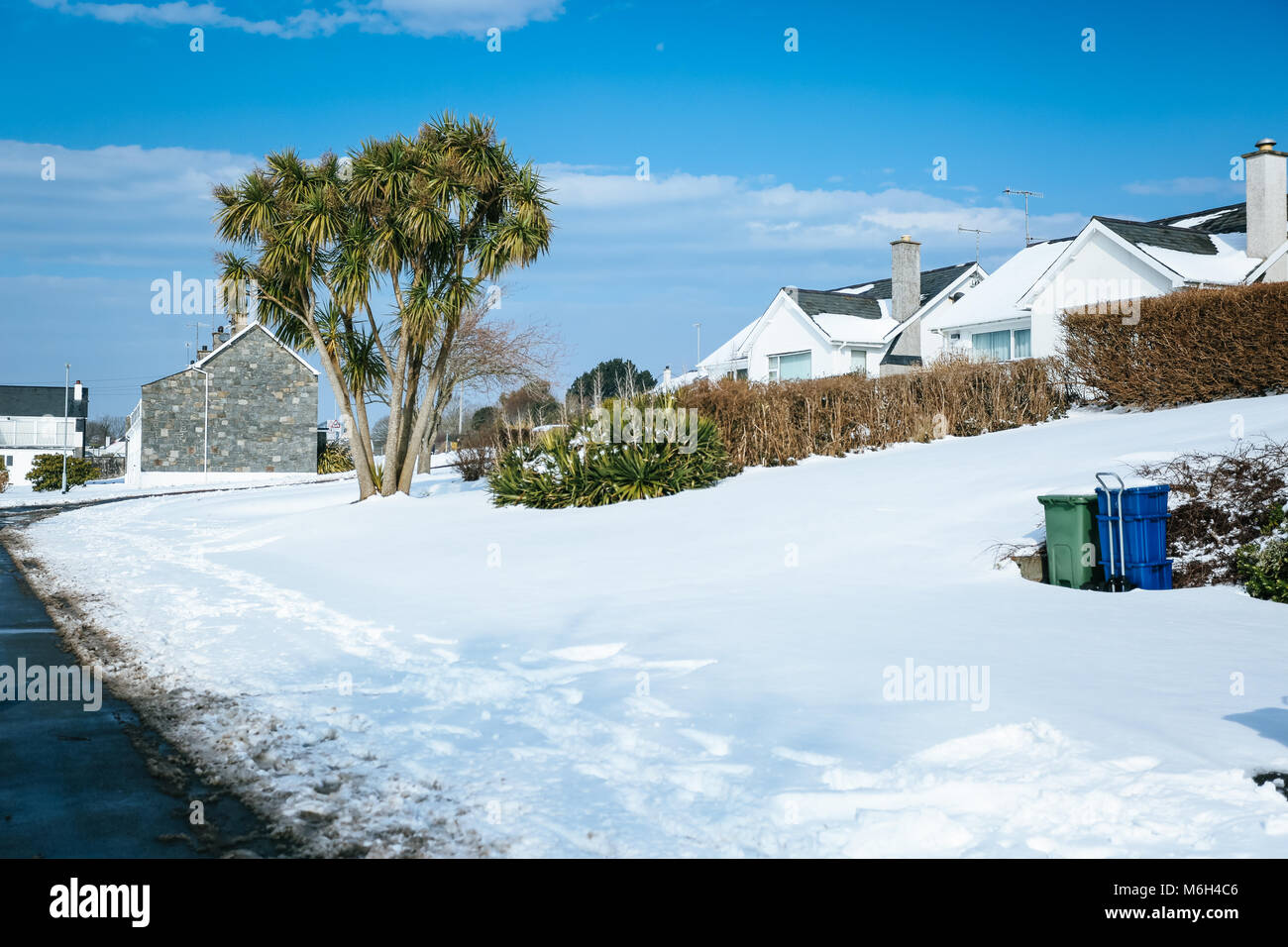The after effects of Storm Emma is seen in the seaside village of Abersoch, with heavy snow drifts, wind, snow on the beach and a frozen harbour. Stock Photo