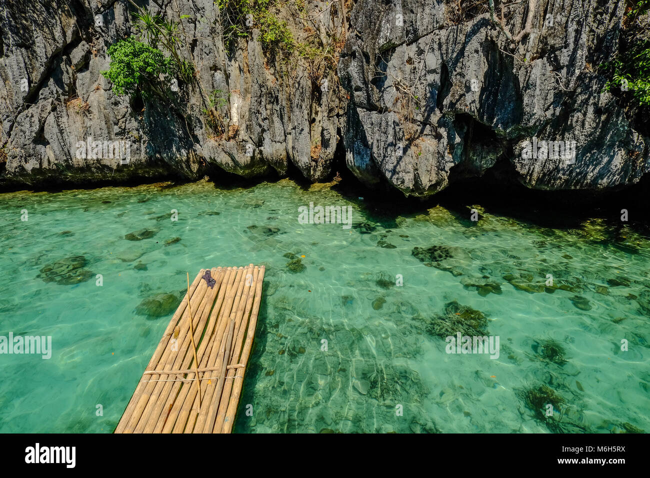 Philippine Raft A wooden raft on blue sea in Palawan Island, Philippines Stock Photo ...