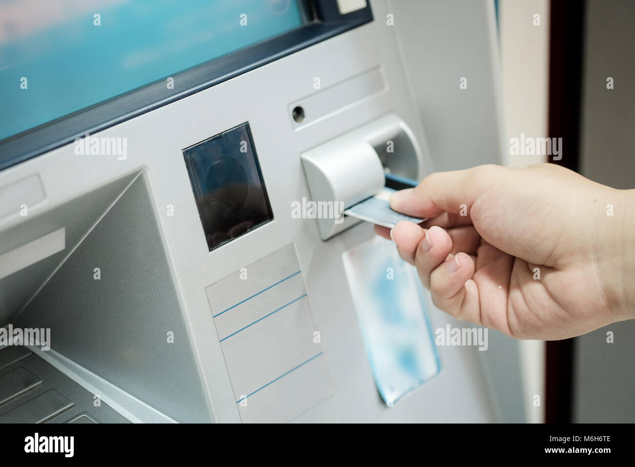 Closeup of automatic teller machine,ATM inserting a card. Stock Photo