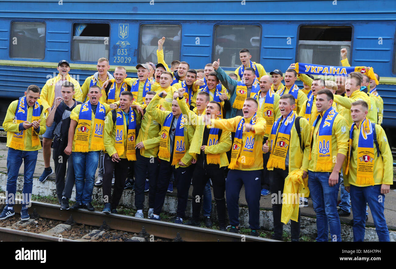 KHARKIV, UKRAINE - SEPTEMBER 2, 2017: Ukrainian National Football Team supporters pose for a group photo on the Kharkiv Railway station before the FIF Stock Photo