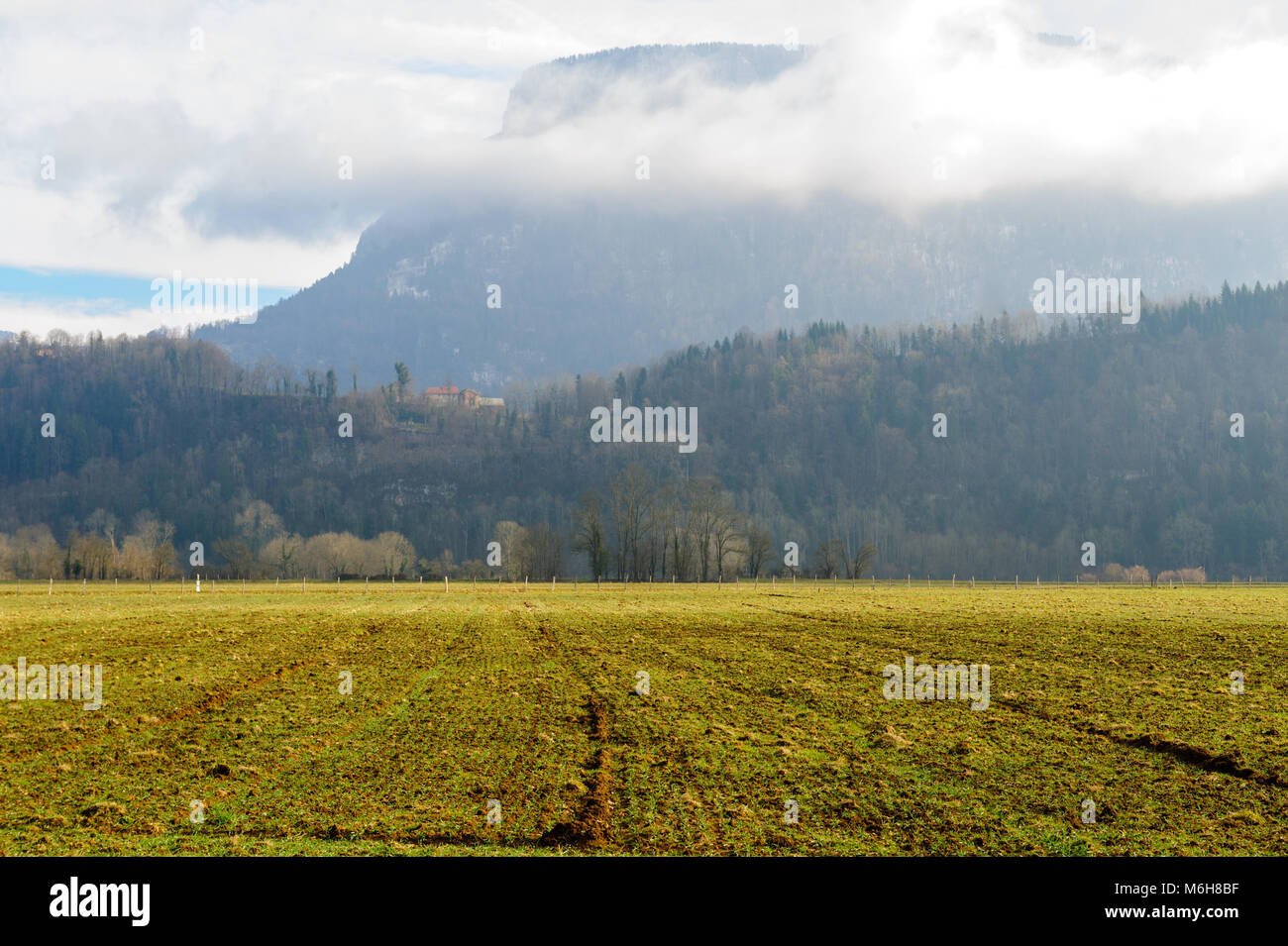 Mountain shrouded in clouds Stock Photo - Alamy