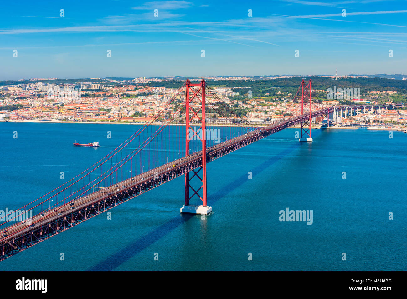 April 25th Bridge and Tagus River in Lisbon Portugal, as seen from the top of the Christ The King Statue Stock Photo