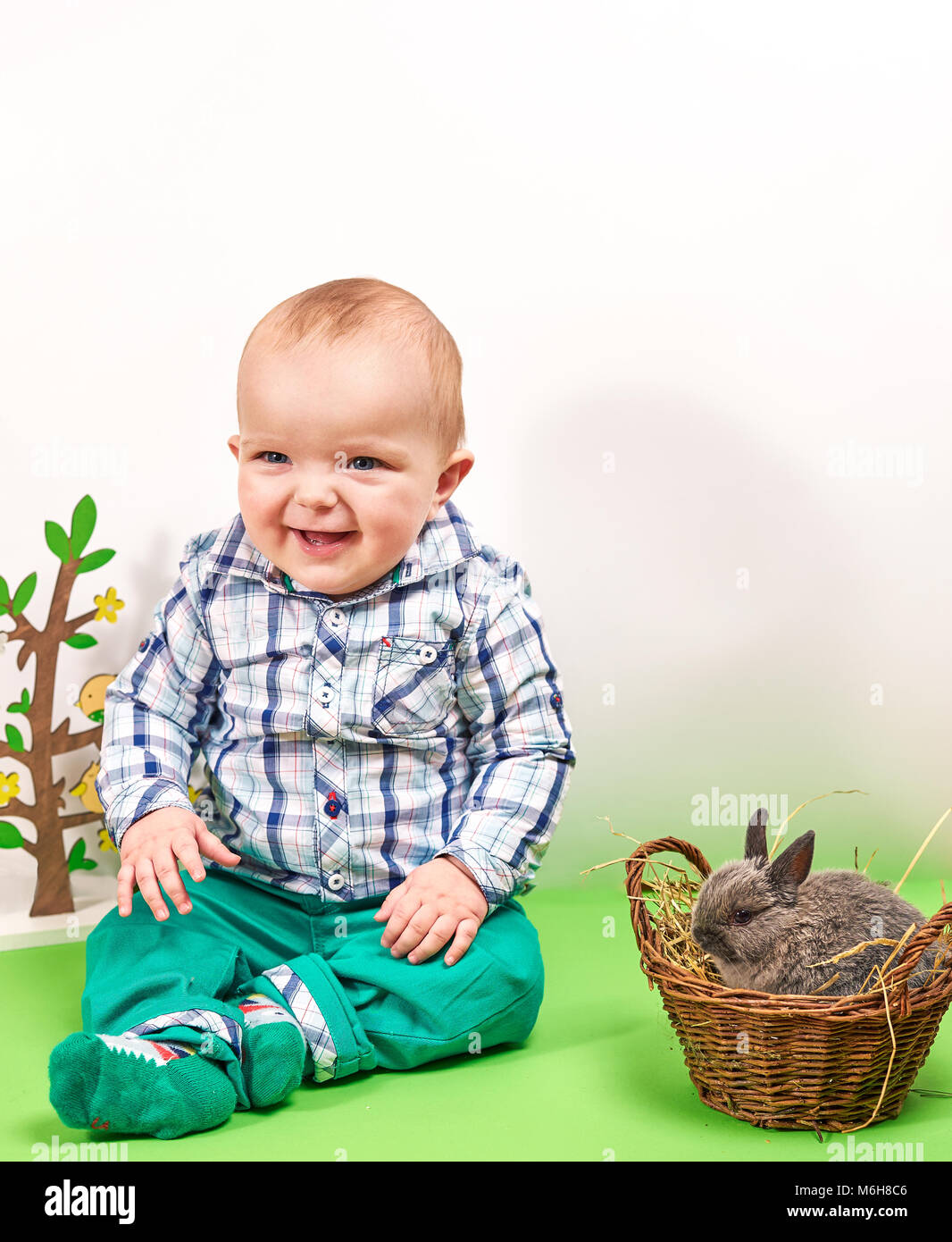 Happy baby boy with bunny Stock Photo