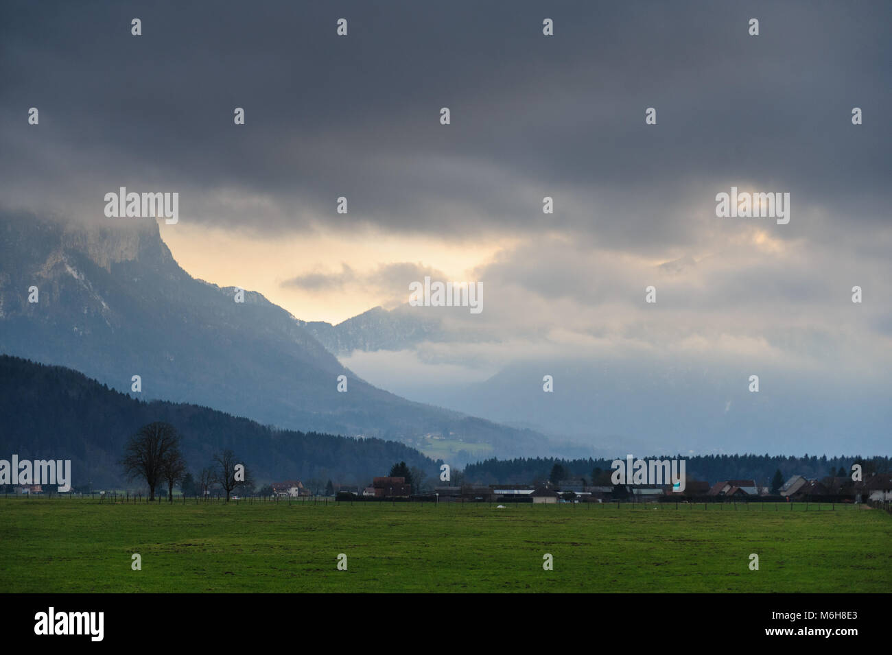 Mountain shrouded in clouds Stock Photo - Alamy