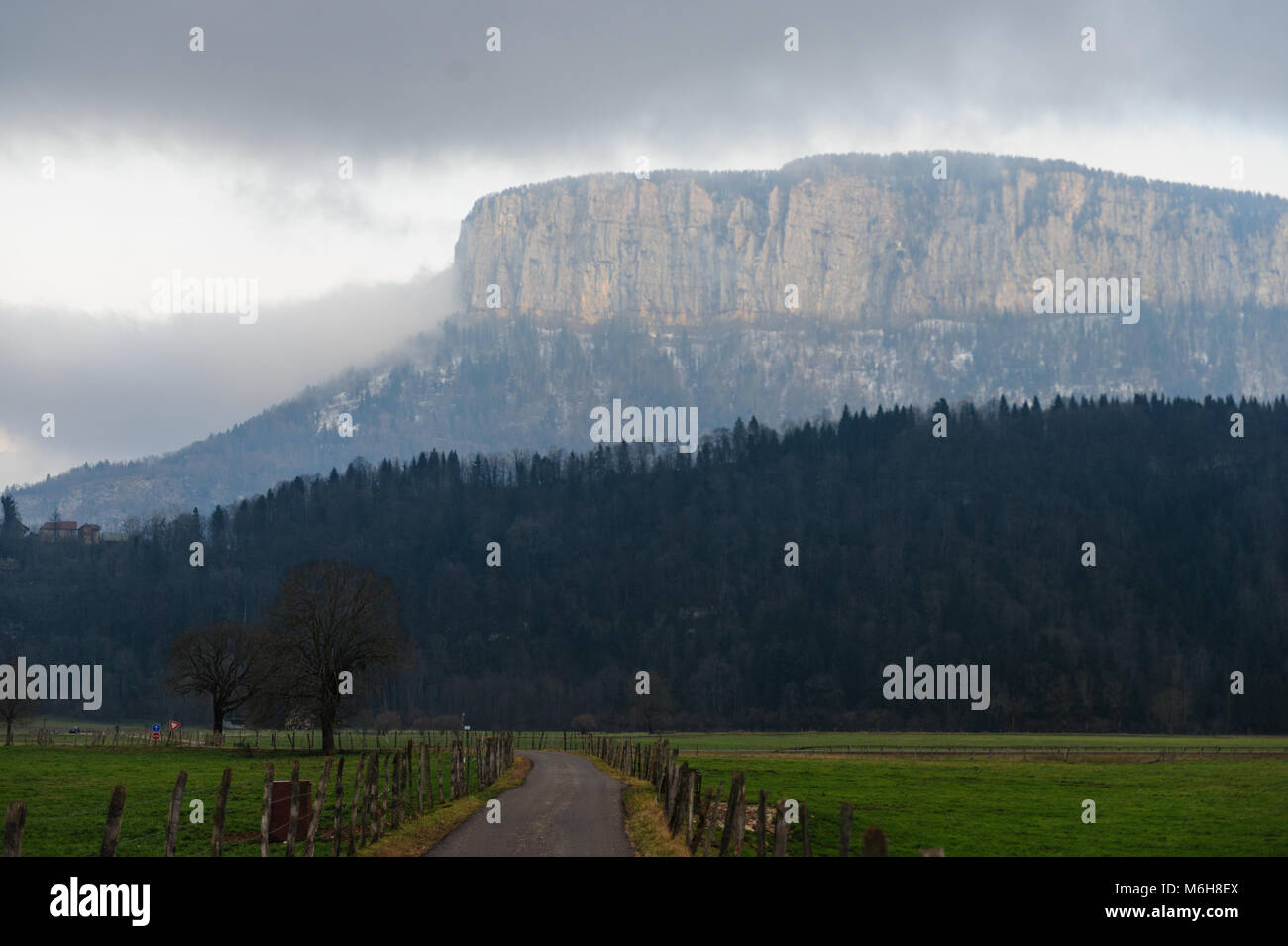 Mountain shrouded in clouds Stock Photo - Alamy