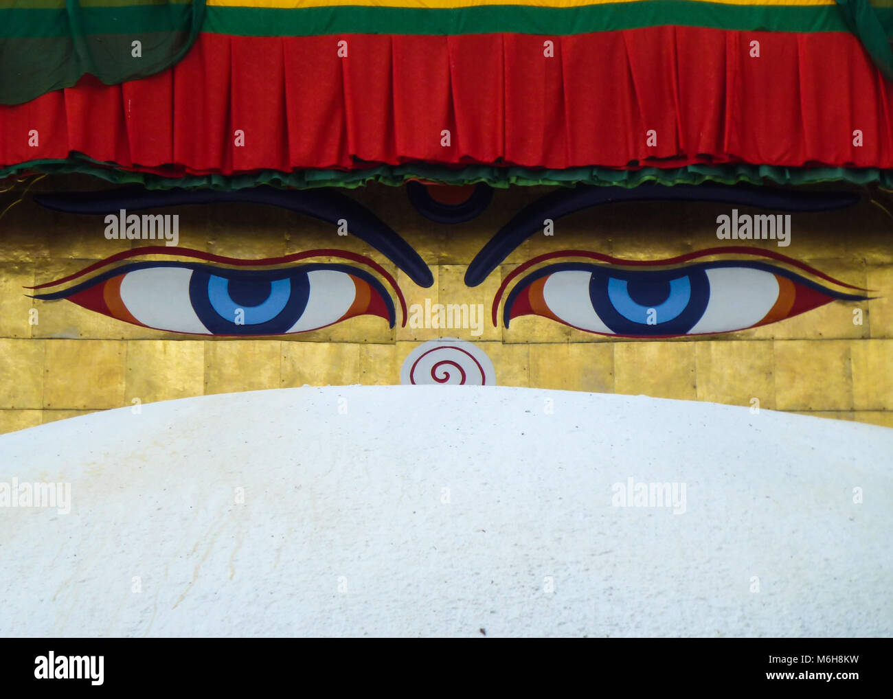 detail of the eyes of Buddha painted over the dome of the Boudhanath Stupa, Kathmandu, Nepal Stock Photo