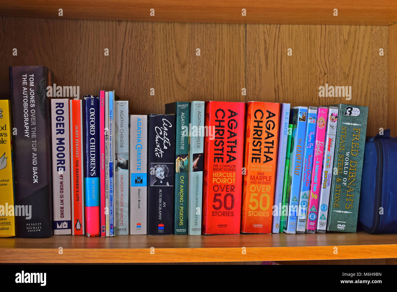 A row of books on a home study bookshelf, mainly by the famous crime writer - Agatha Christie Stock Photo