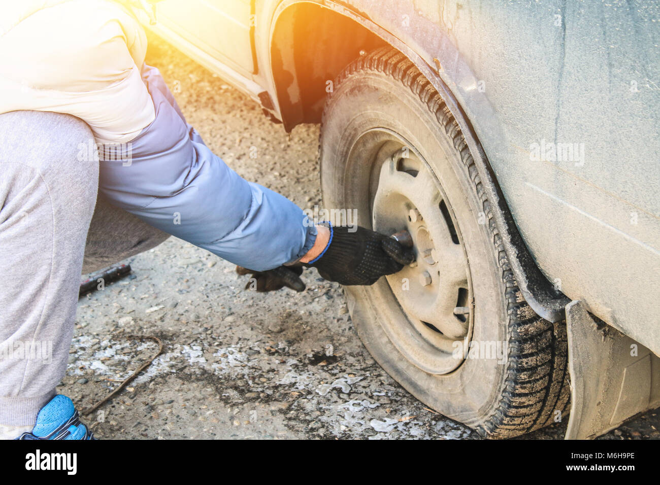 Deflated Wheel Tag tap the wrench to replace the deflated wheel on the machine Stock Photo ...