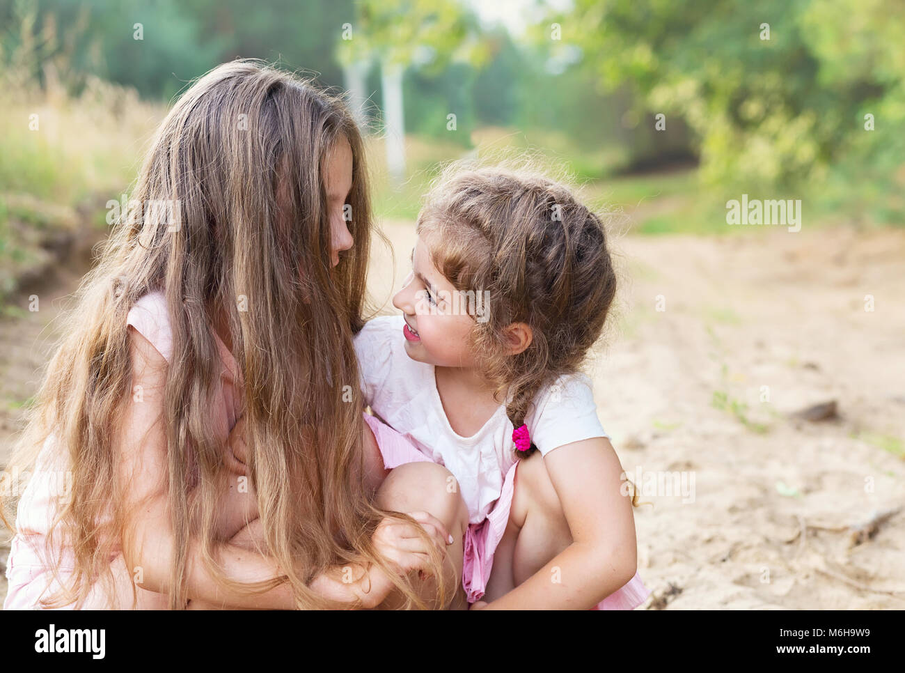 Beautiful Young Girls With Long Hair Smiling And Talking At