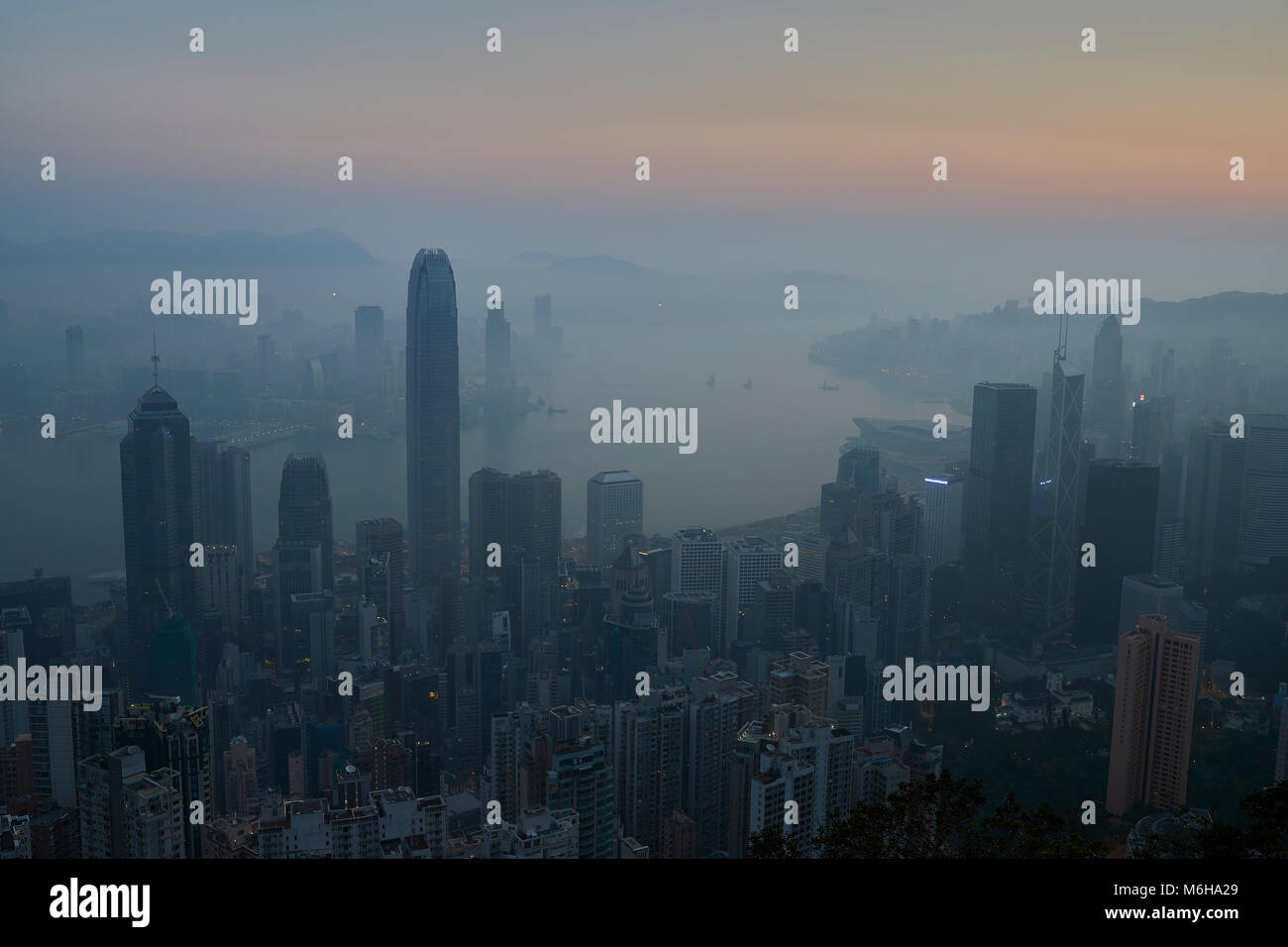 Hong Kong Skyline And Victoria Harbour At Sunrise, Viewed From The Peak ...